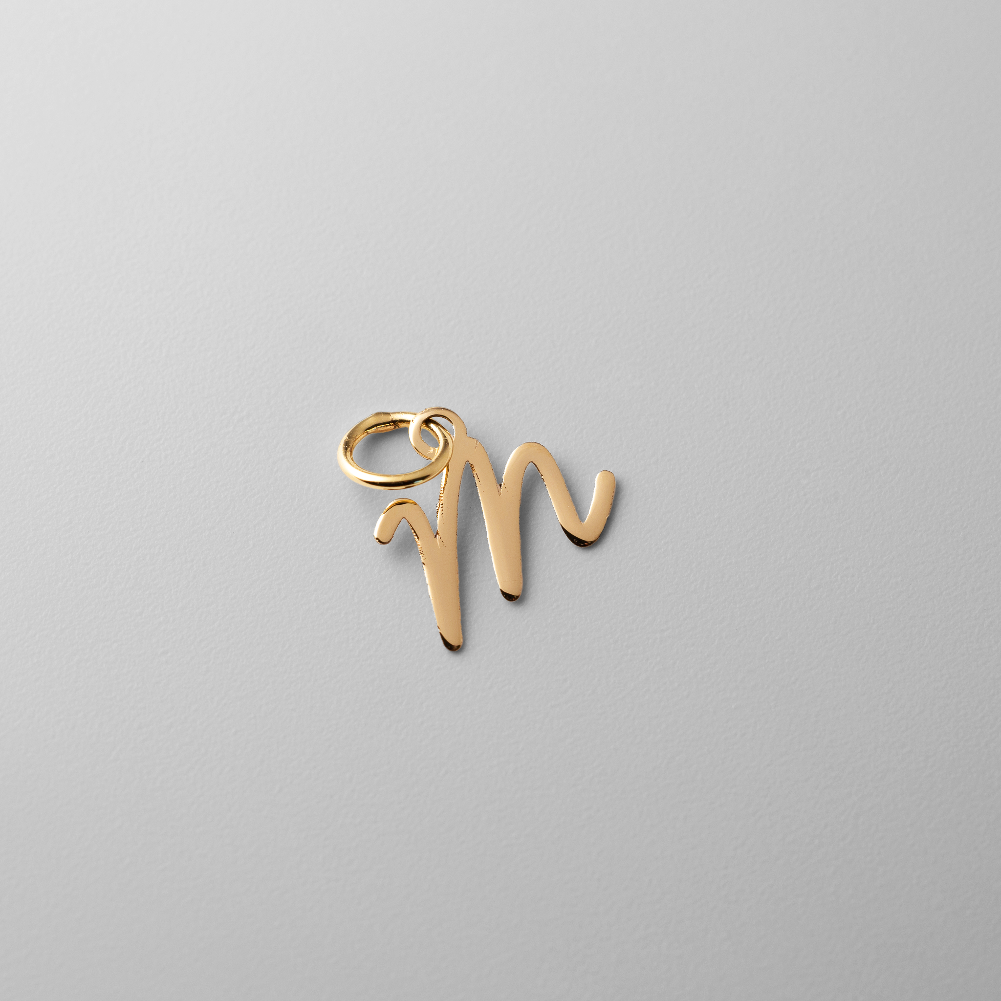 Gold Script Letter "M" Small Initial Pendant - Model XNA1467Y - Charlie & Co. Jewelry