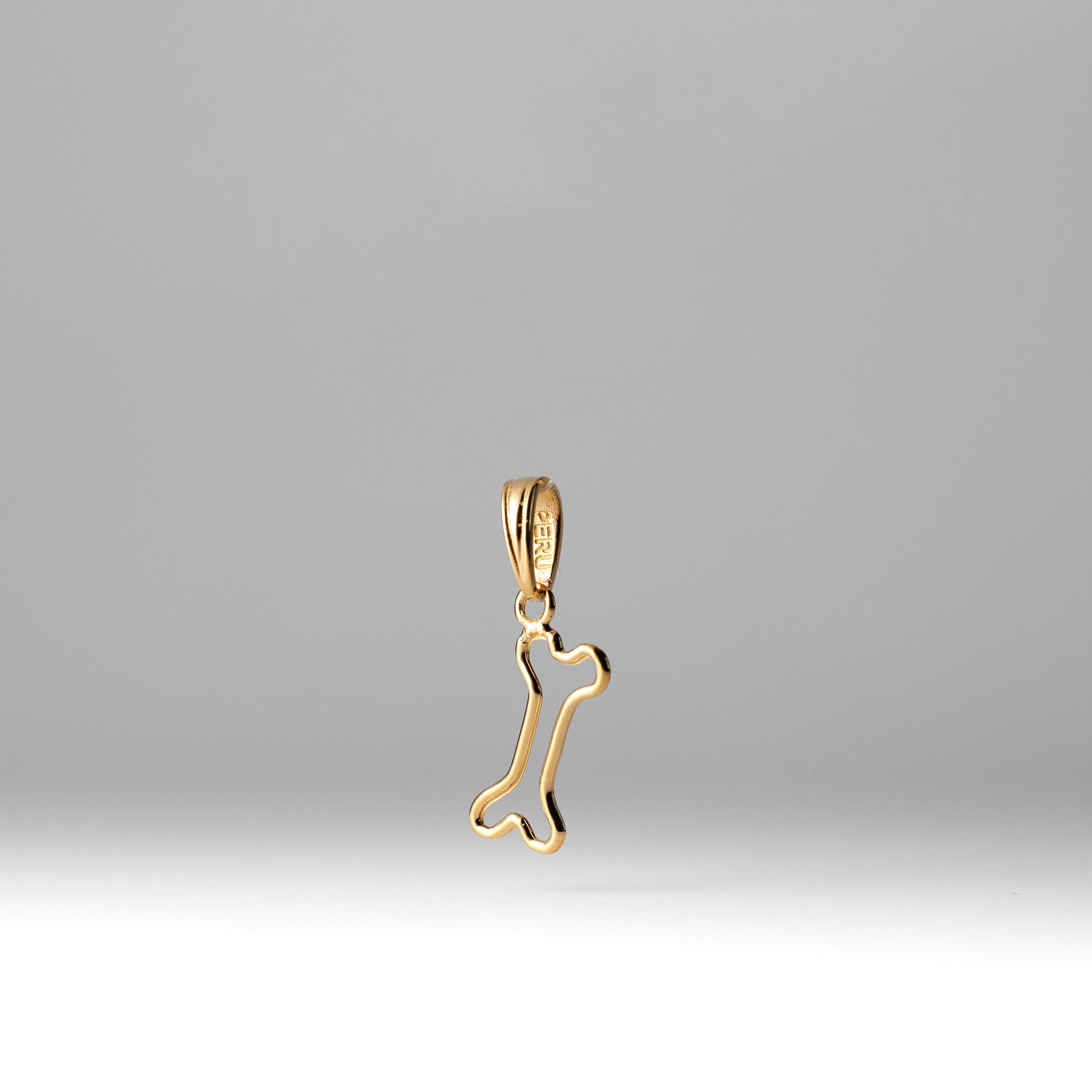 Gold Cut-Out Dog Bone Pendant - Charlie & Co. Jewelry