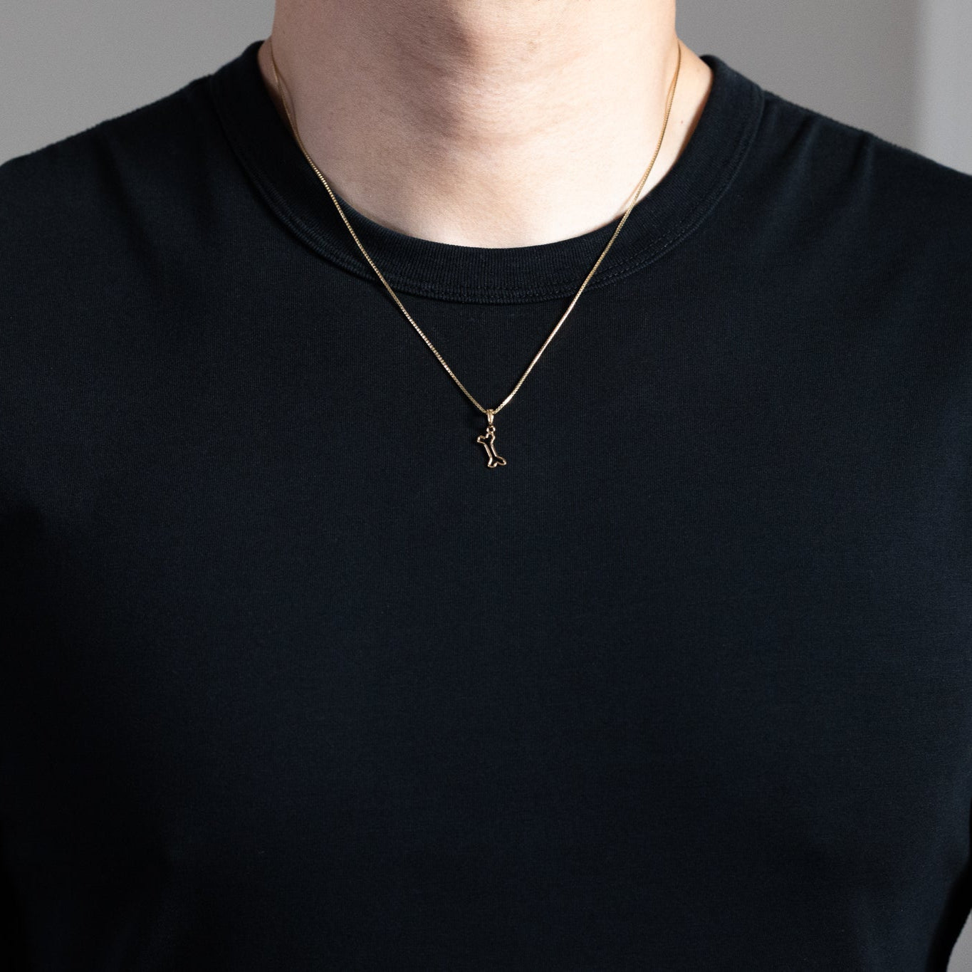 Gold Cut-Out Dog Bone Pendant - Charlie & Co. Jewelry