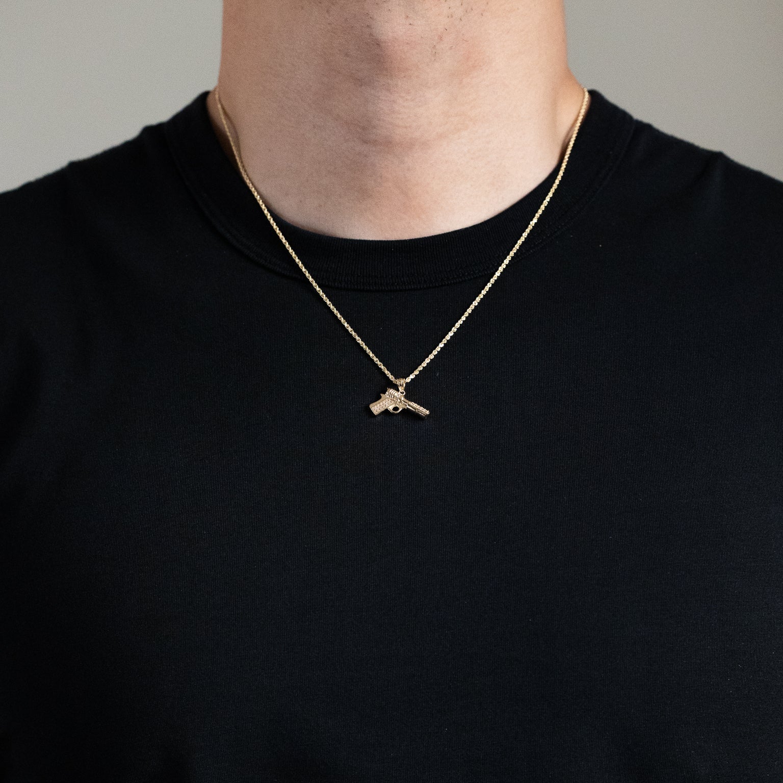 Gold With CZ Stones Pistol Pendant Necklace - Model PT2748 - Charlie & Co. Jewelry