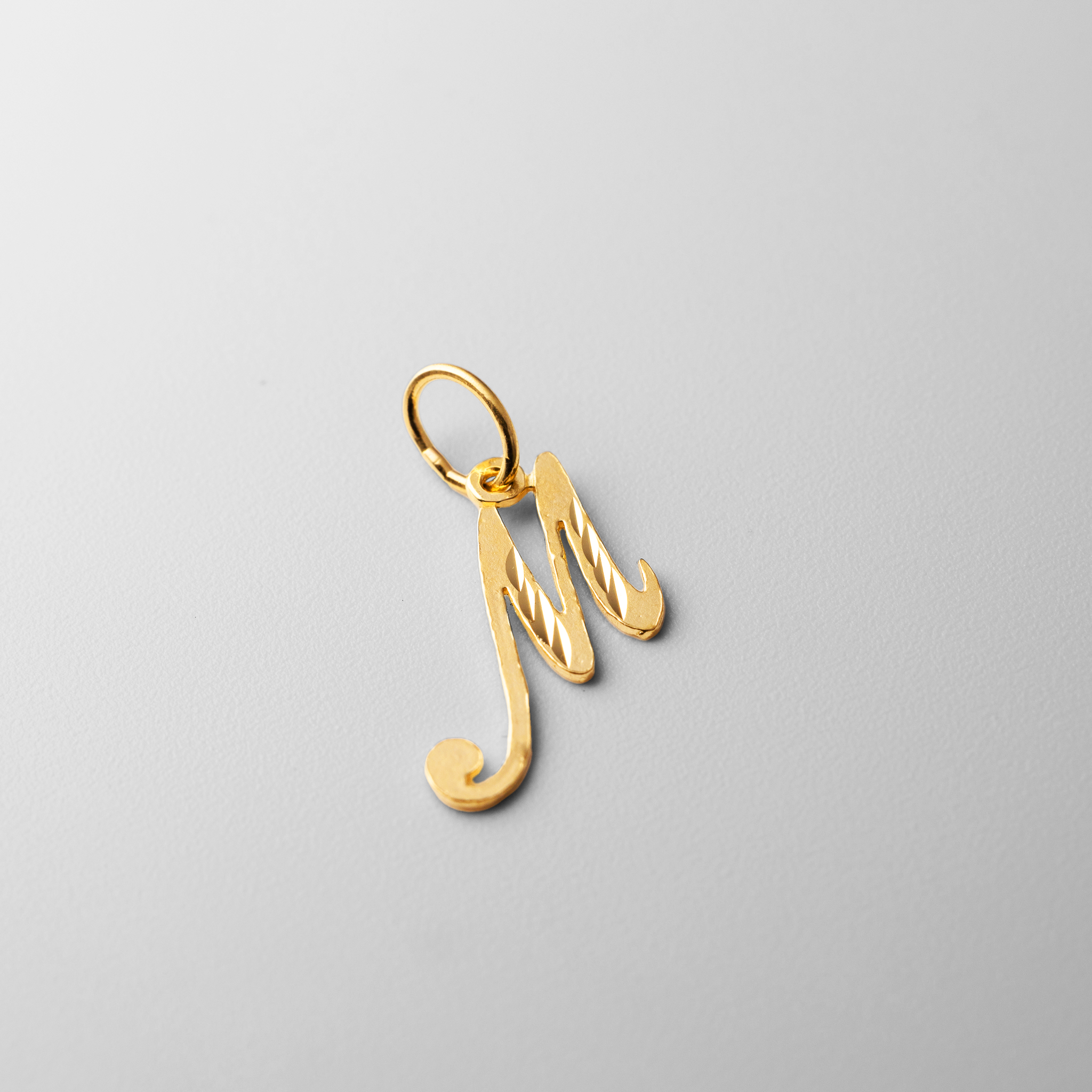 Gold Calligraphy Letter M Pendant | A-Z Pendants - Charlie & Co. Jewelry
