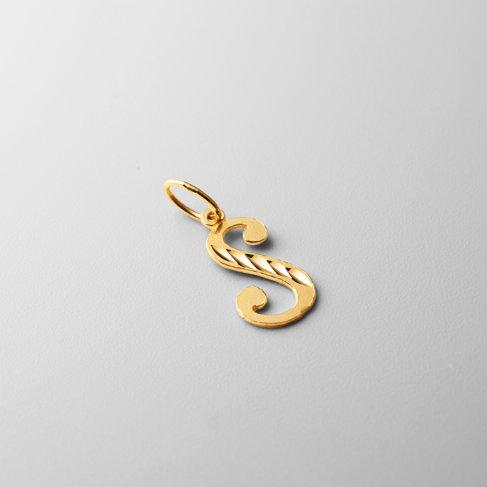 Gold Calligraphy Letter S Pendant | A-Z Pendants - Charlie & Co. Jewelry