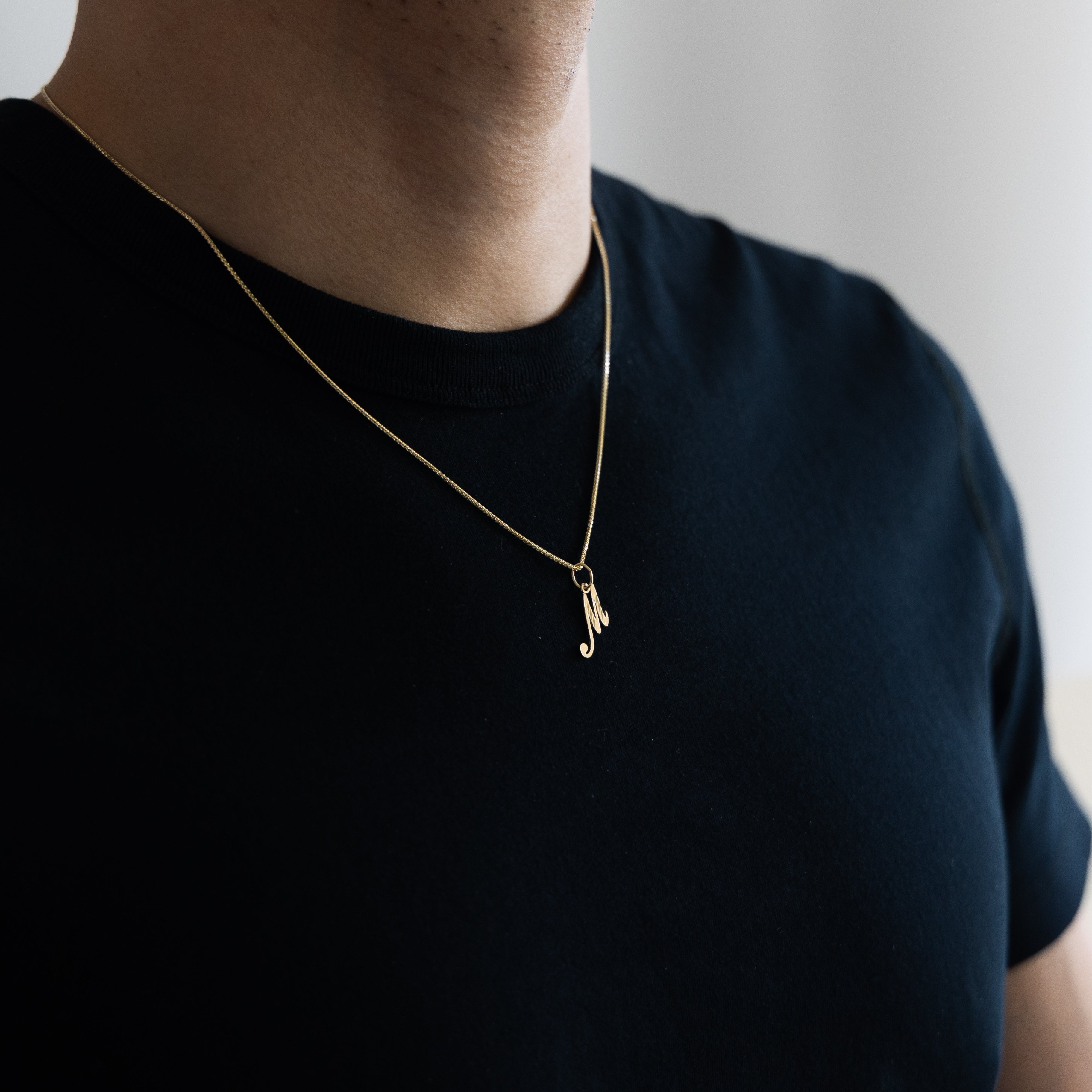Gold Calligraphy Letter M Pendant | A-Z Pendants - Charlie & Co. Jewelry