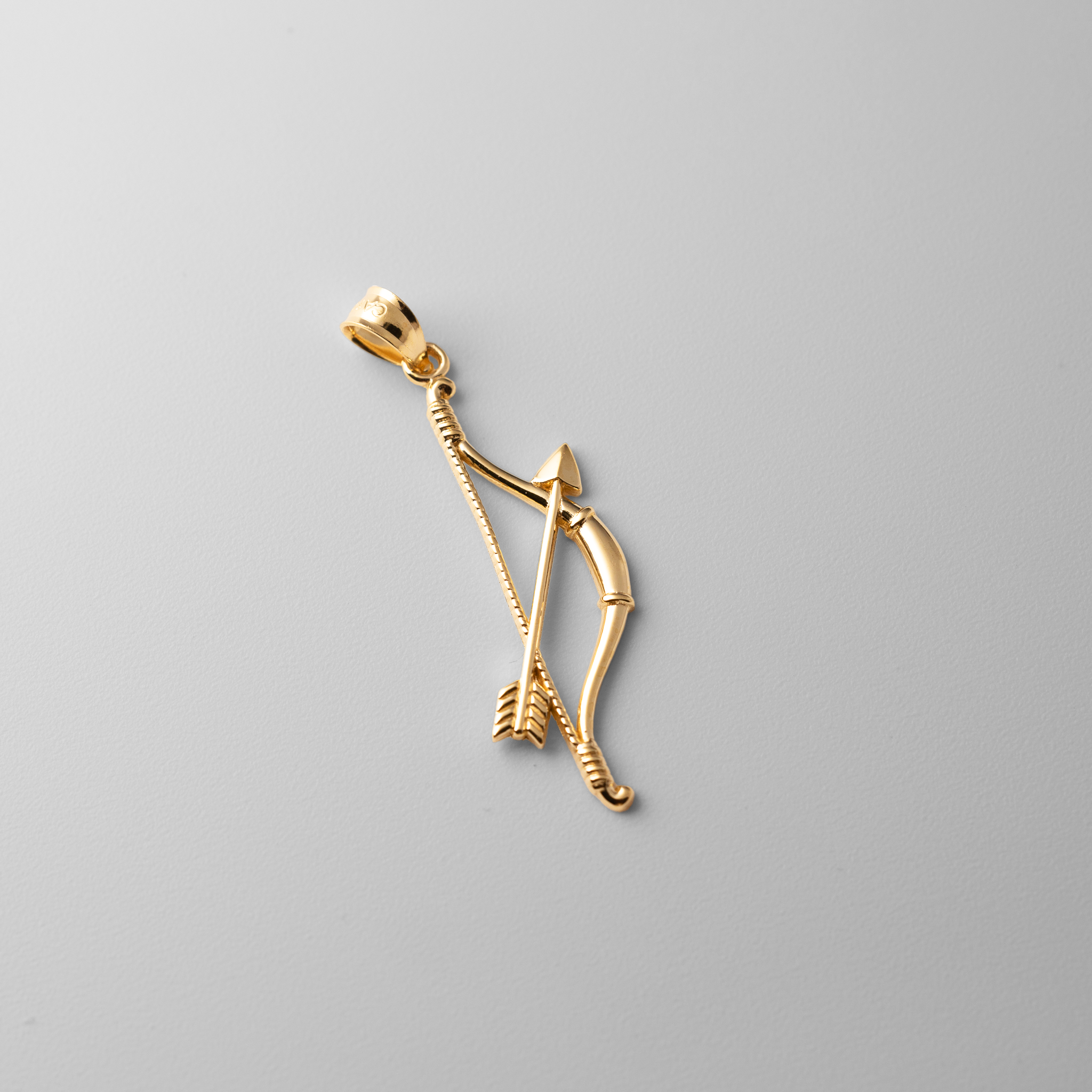 Gold Bow and Arrow Pendant - Charlie & Co. Jewelry