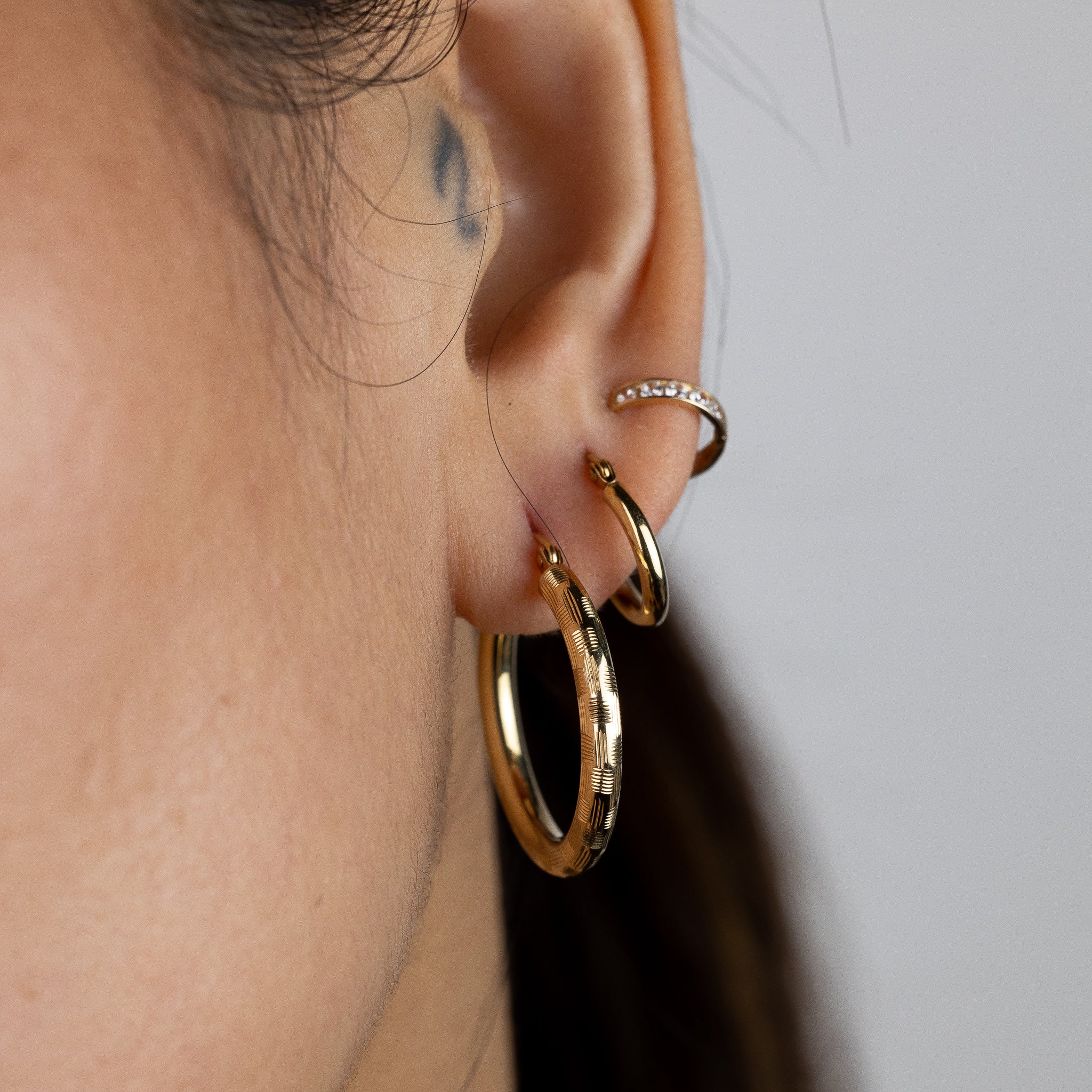 Gold Diamond Cut Huggie Hoop Earrings 25MM Wide - Model 1013 - Charlie & Co. Jewelry