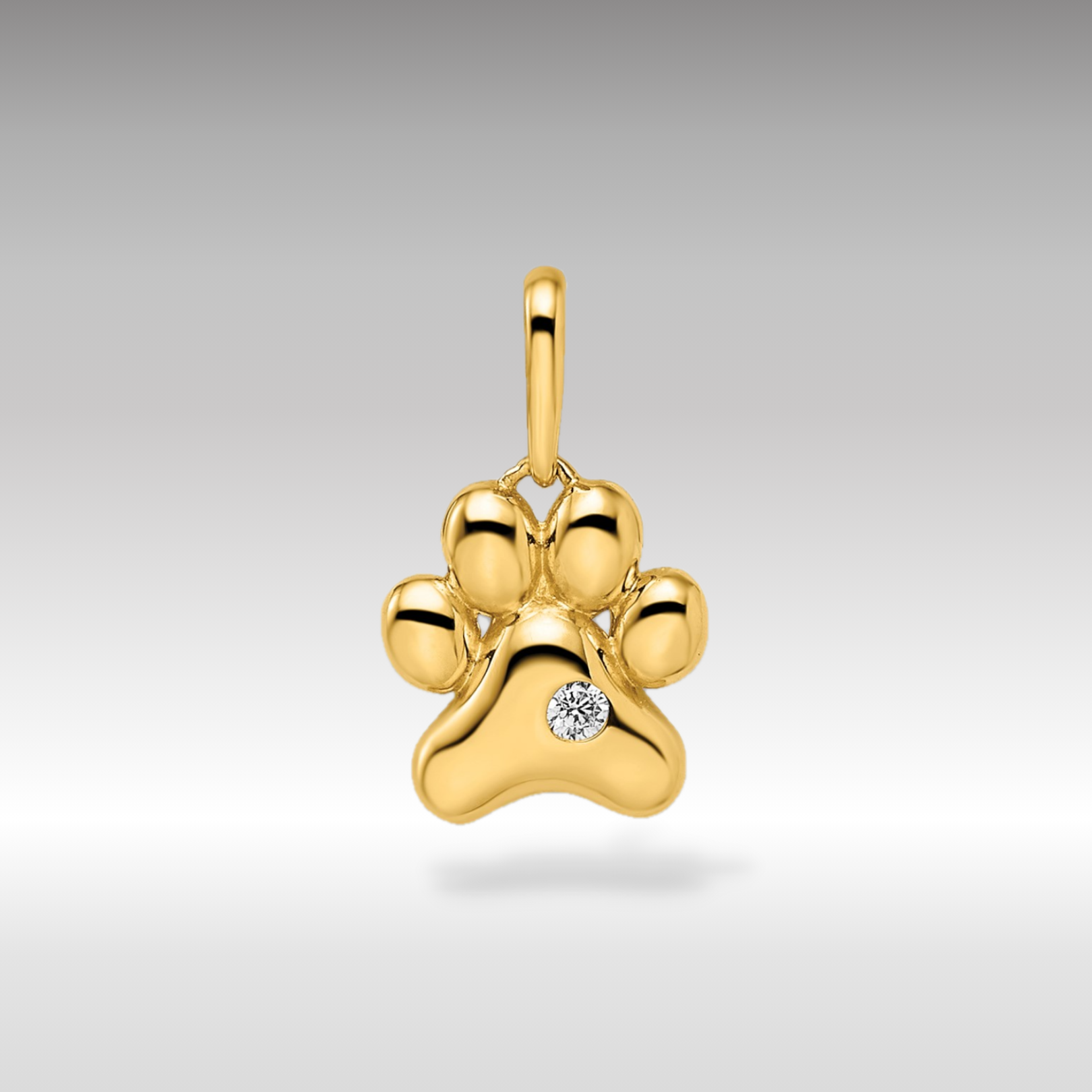 14k Madi K CZ Paw Print Pendant - Charlie & Co. Jewelry
