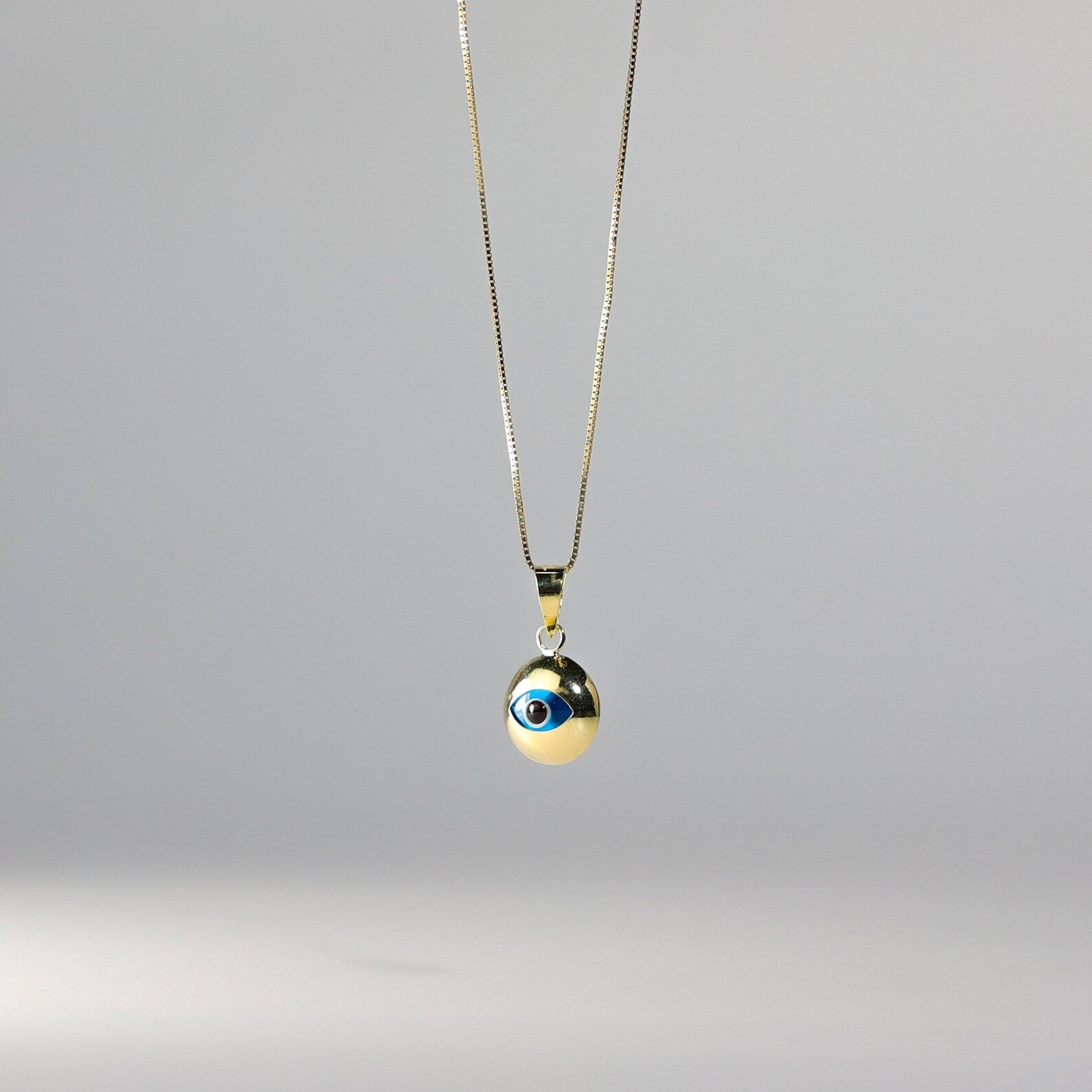 Gold Evil Eye Round Hamsa Pendant - Charlie & Co. Jewelry