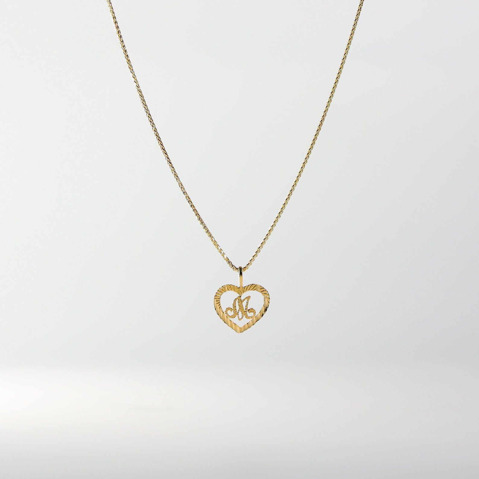 Gold Heart-Shaped Letter M Pendant | A-Z Pendants - Charlie & Co. Jewelry