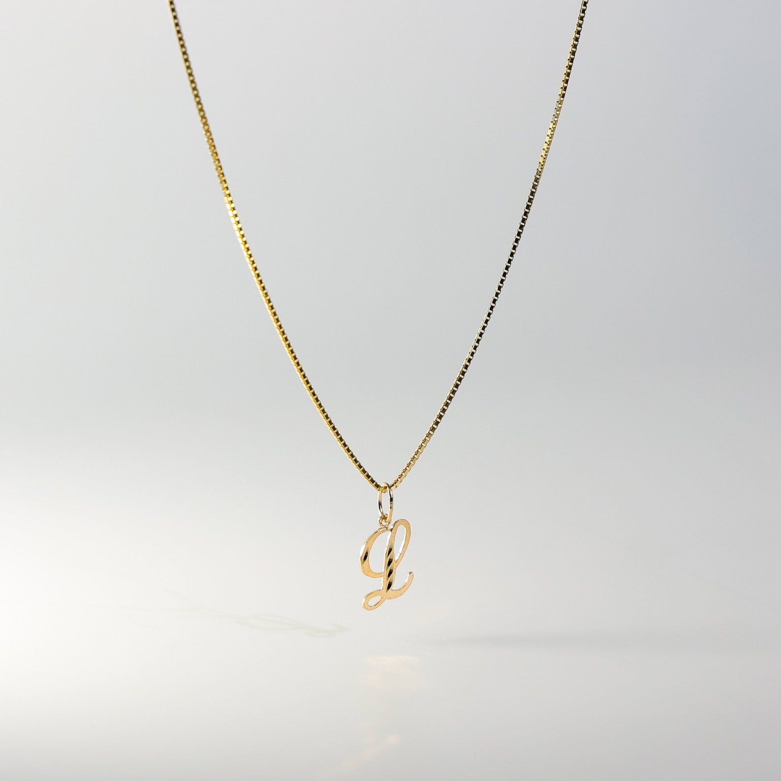 Gold Calligraphy Letter L Pendant | A-Z Pendants - Charlie & Co. Jewelry
