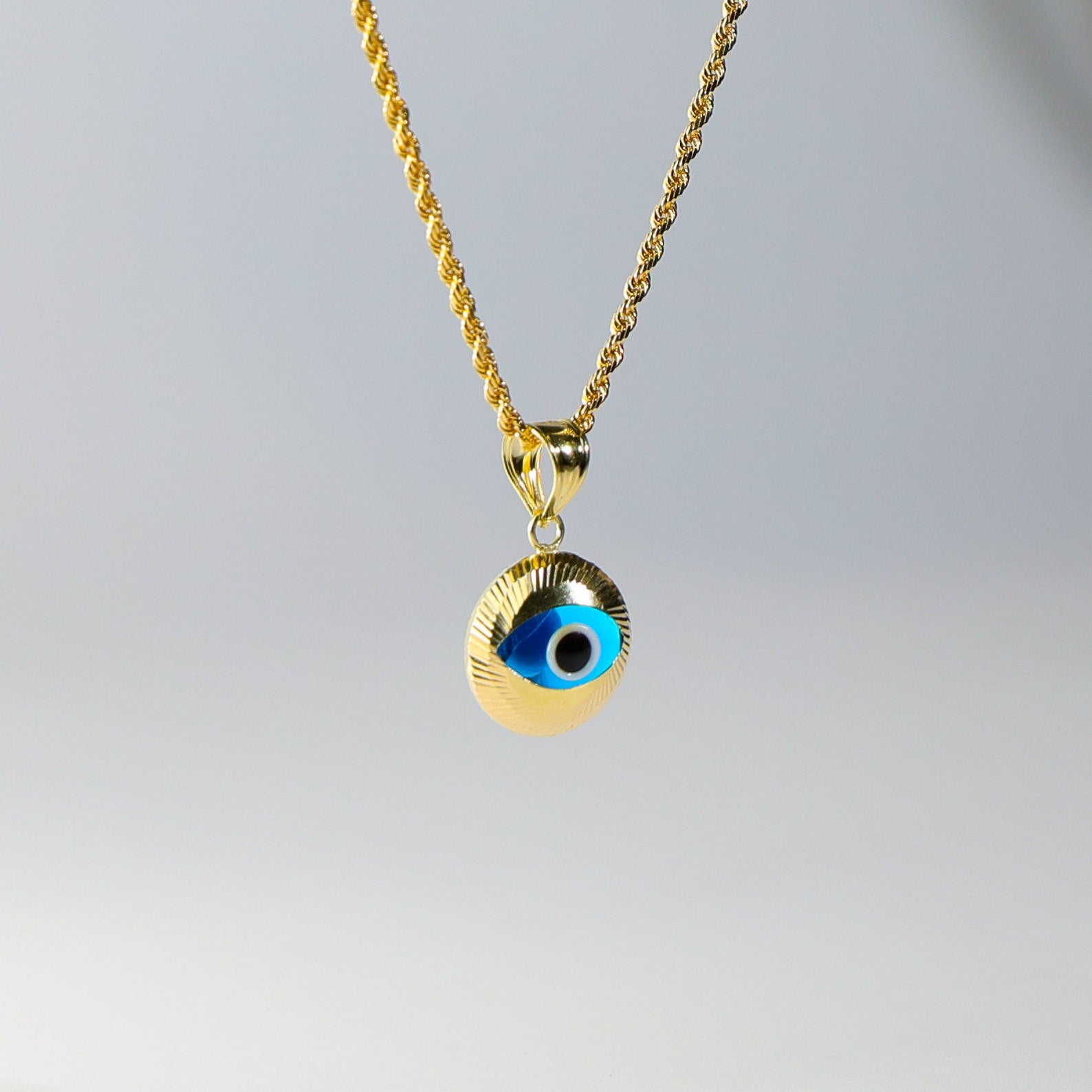Gold Evil Eye Round Hamsa Pendant - Charlie & Co. Jewelry