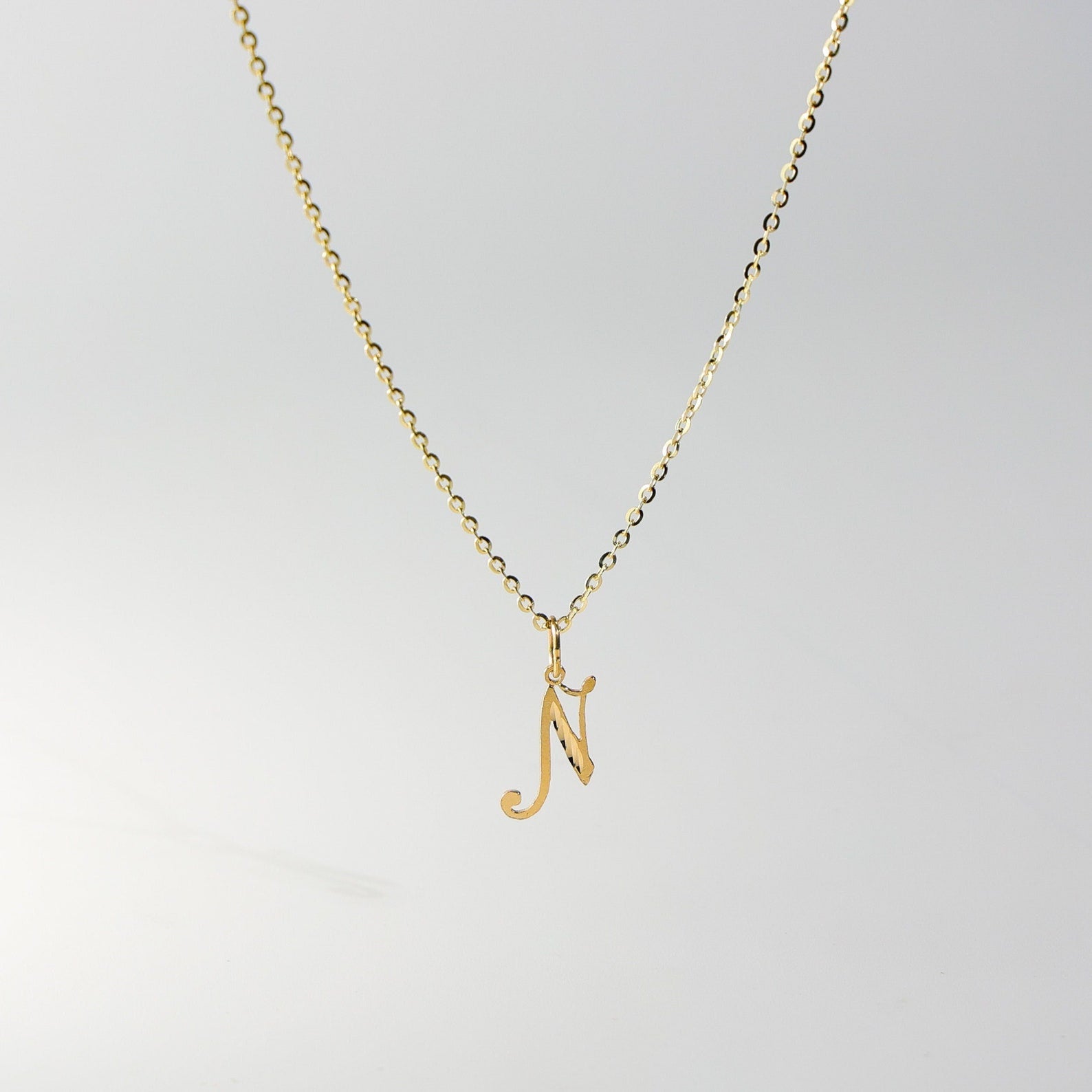 Gold Calligraphy Letter N Pendant | A-Z Pendants - Charlie & Co. Jewelry