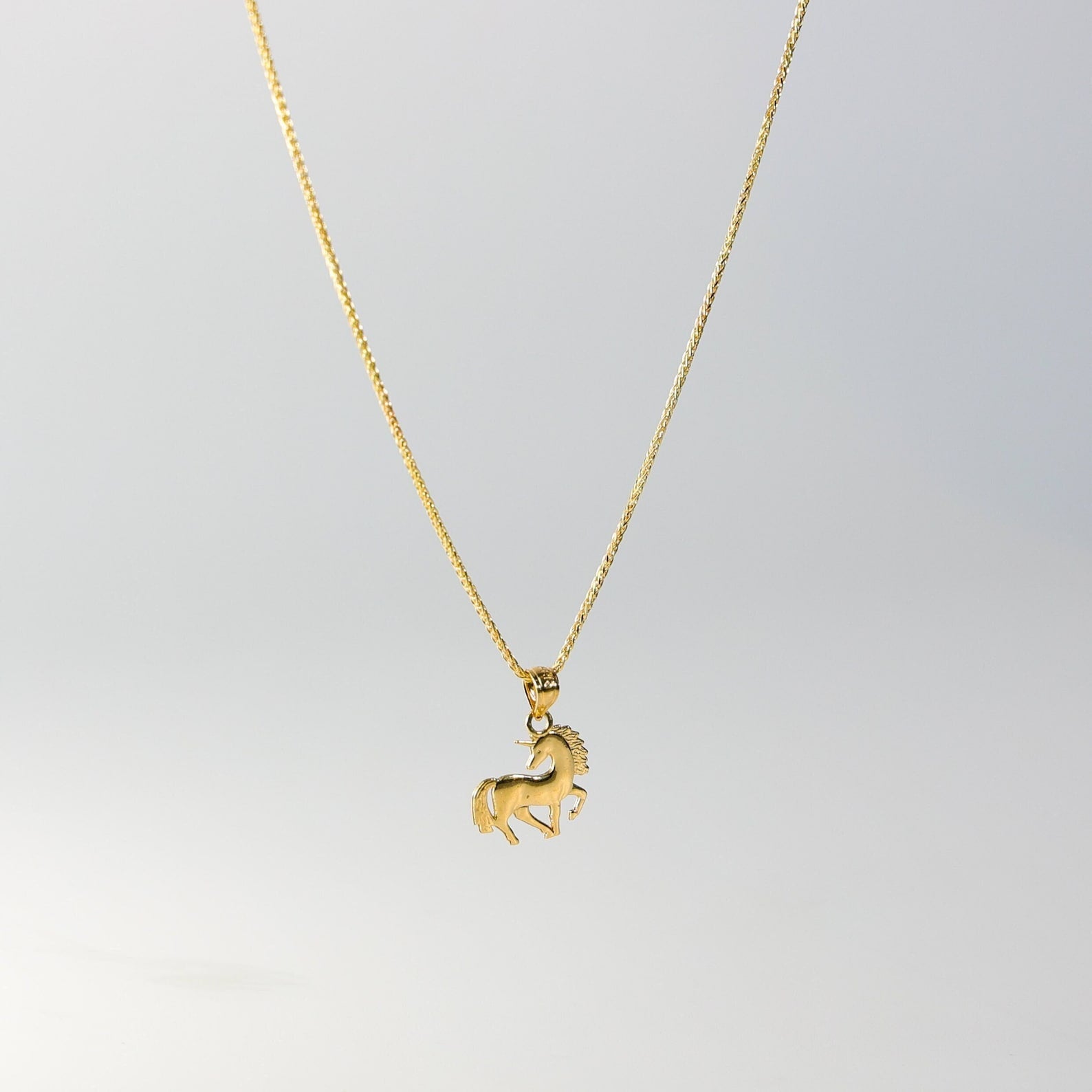 Gold Tiny Unicorn Pendant Model-1651 - Charlie & Co. Jewelry