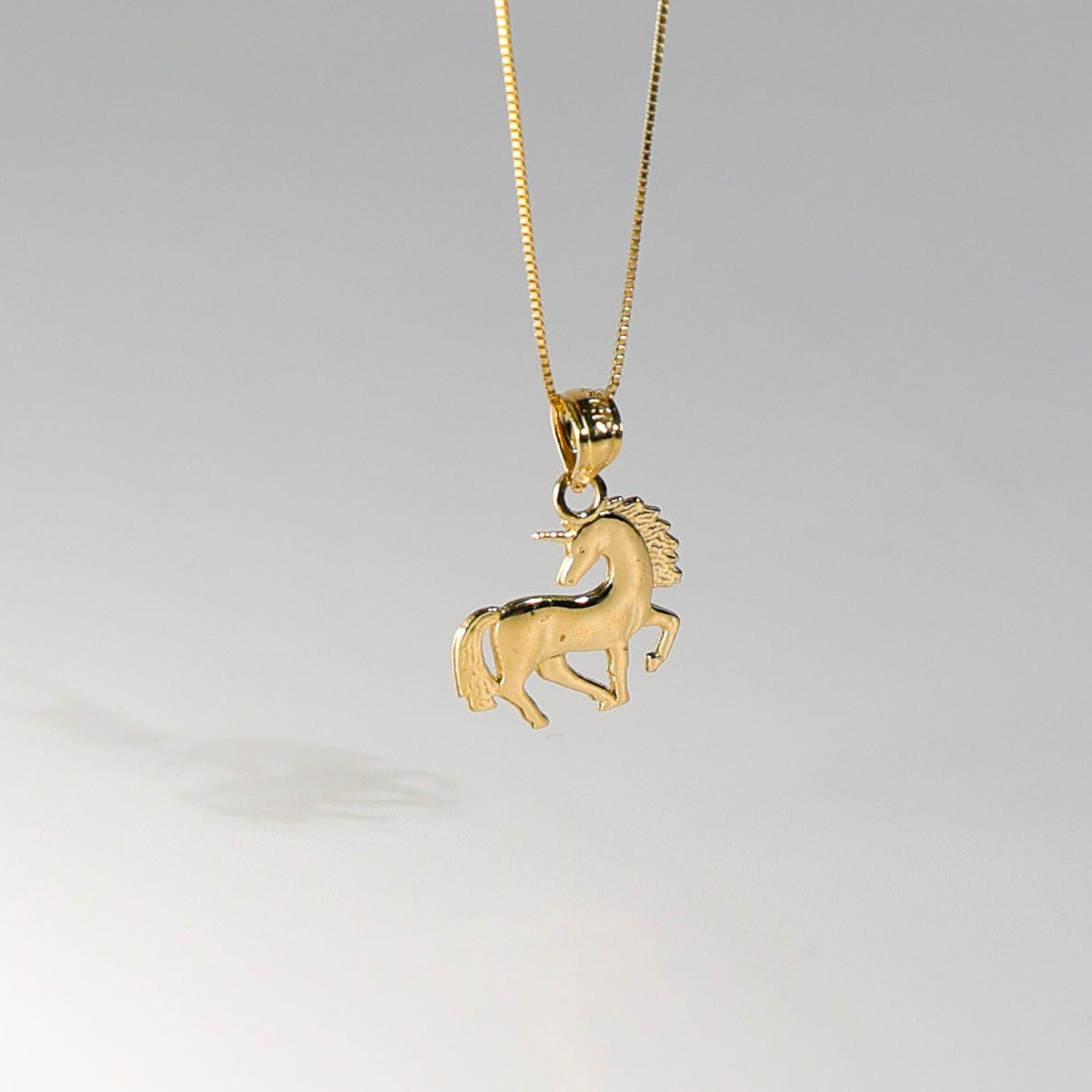 Gold Tiny Unicorn Pendant Model-1651 - Charlie & Co. Jewelry