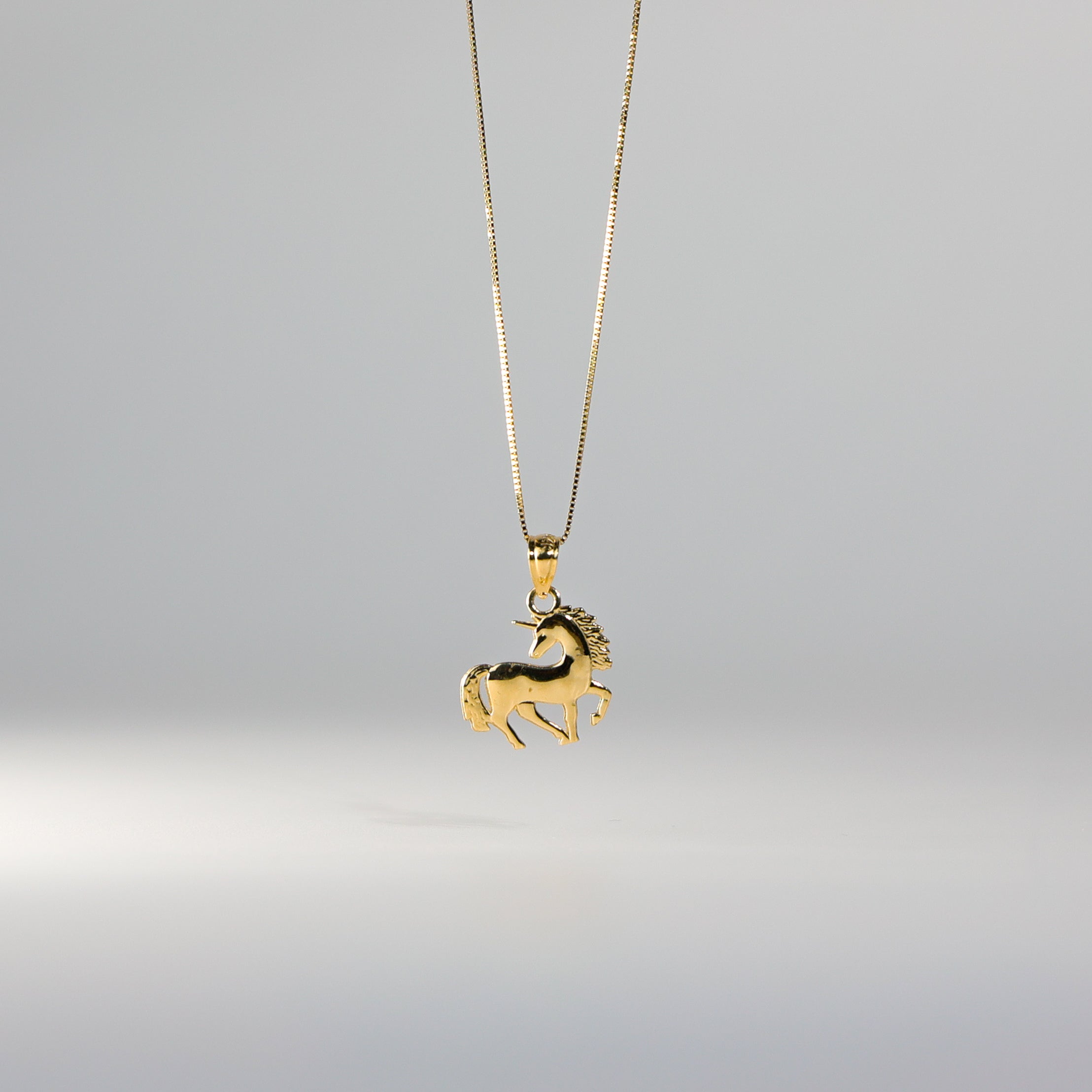 Gold Tiny Unicorn Pendant Model-1651 - Charlie & Co. Jewelry