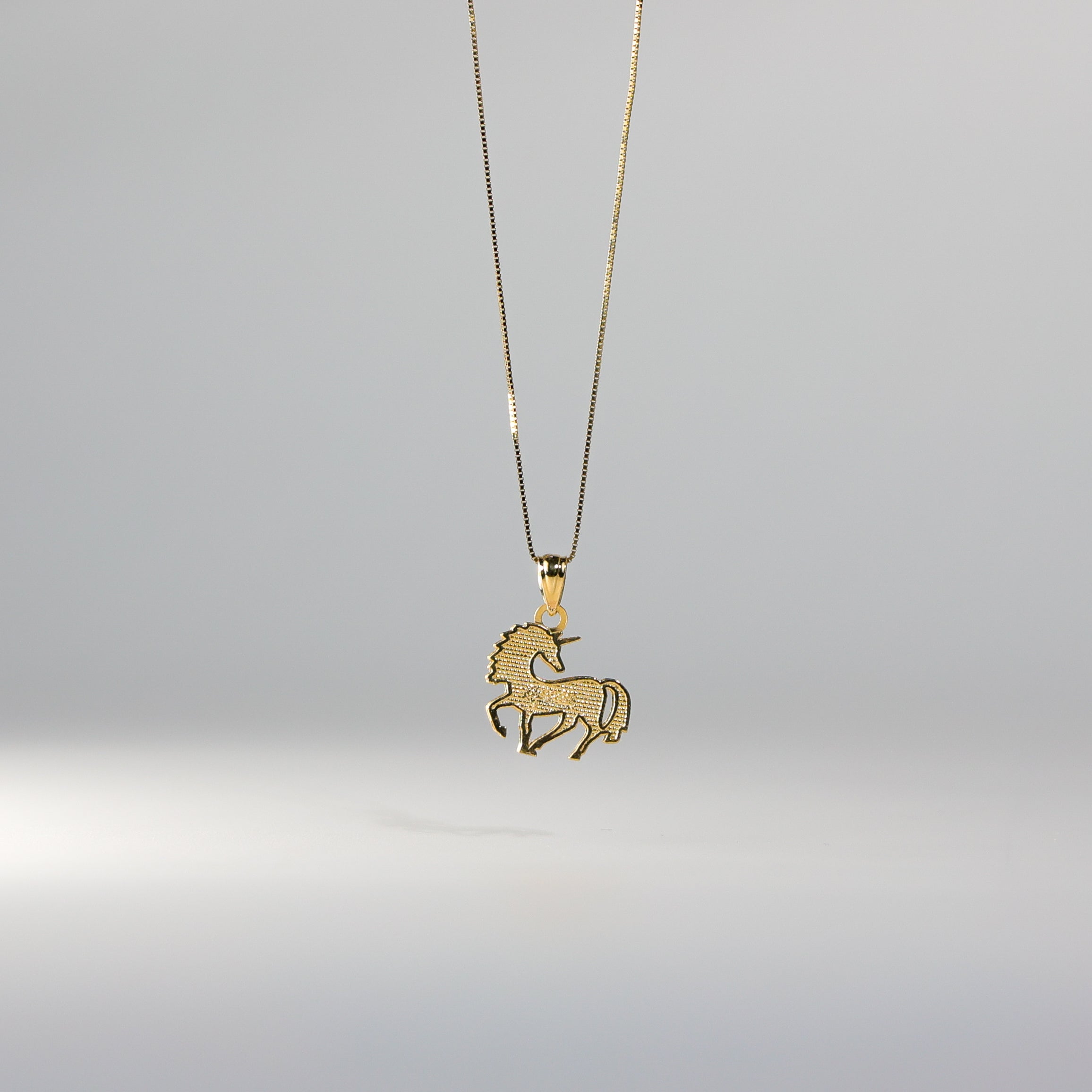 Gold Tiny Unicorn Pendant Model-1651 - Charlie & Co. Jewelry