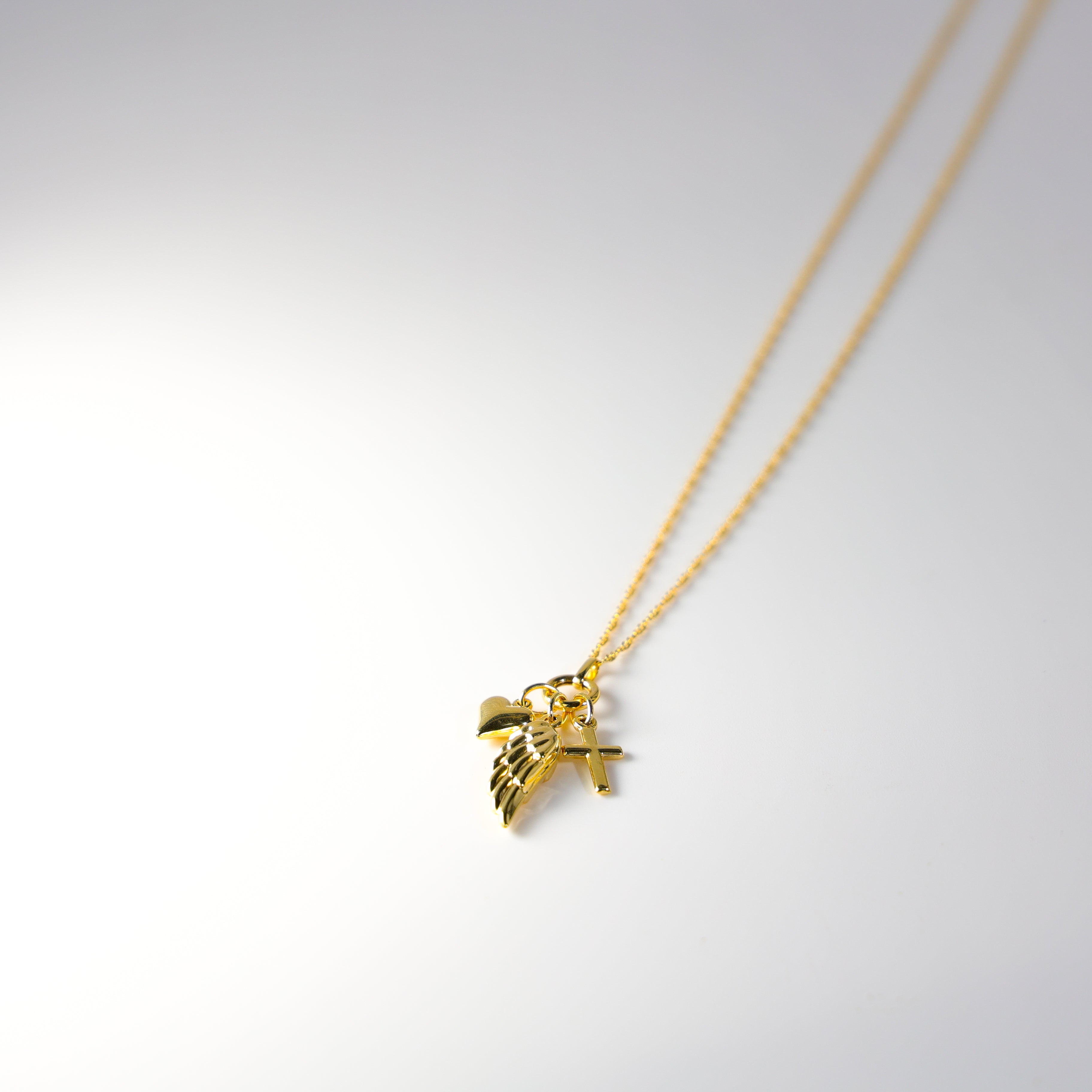 Gold Angel Wing Cross And Heart Necklace Model-NK0152 - Charlie & Co. Jewelry