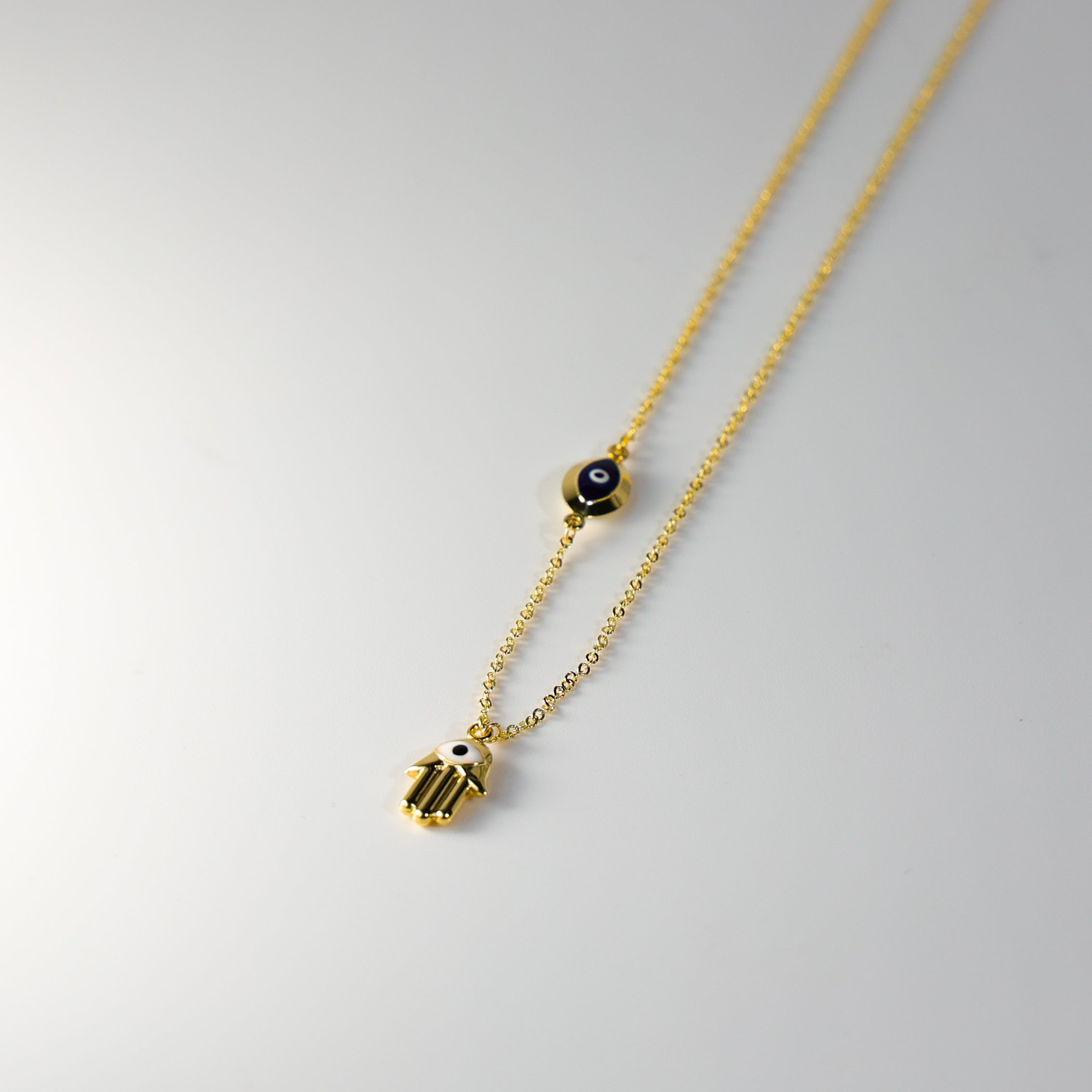 Gold Evil Eye Hamsa Charm Necklace Model-NK0153 - Charlie & Co. Jewelry