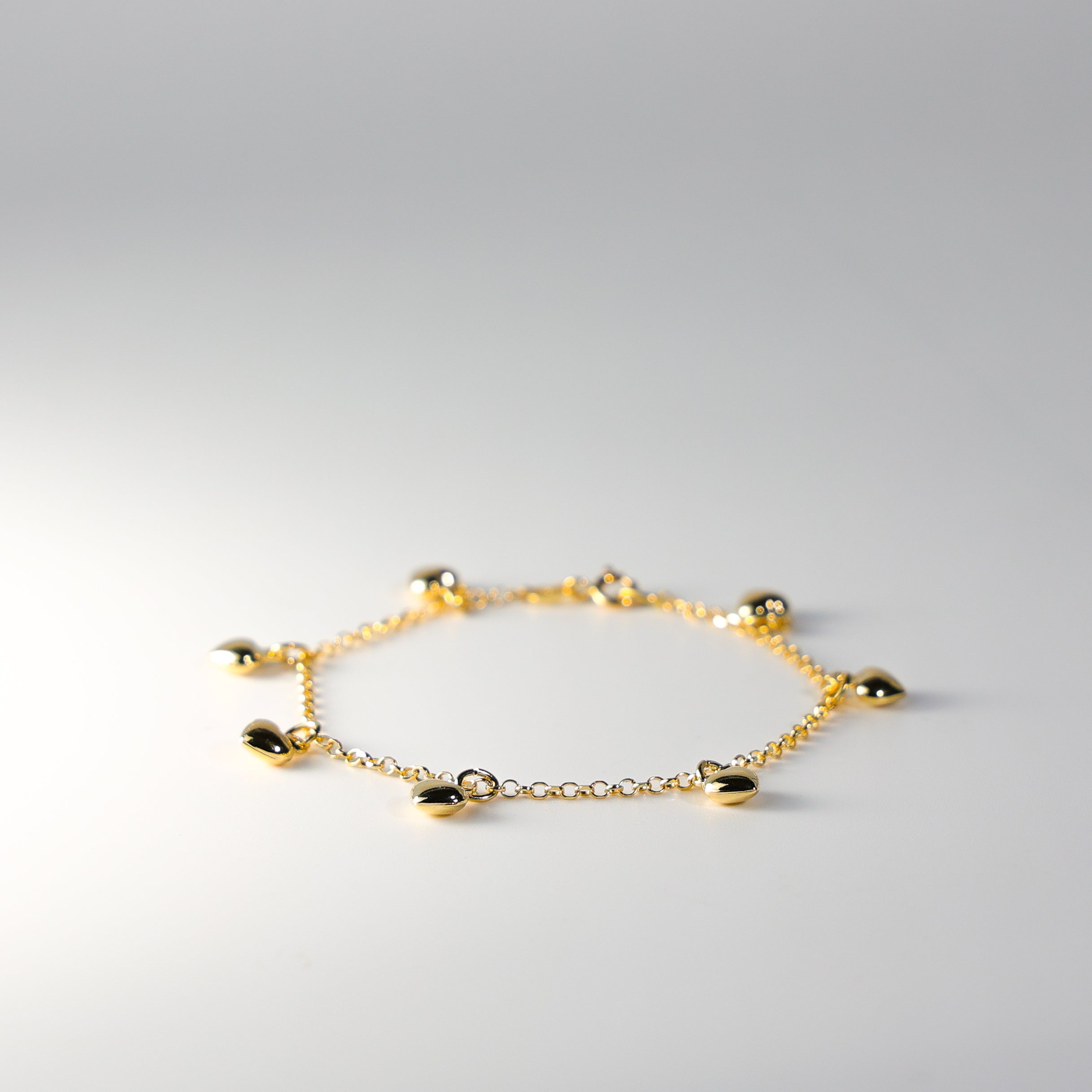 14K Gold Hanging Hearts Bracelet Model-AB0276 - Charlie & Co. Jewelry