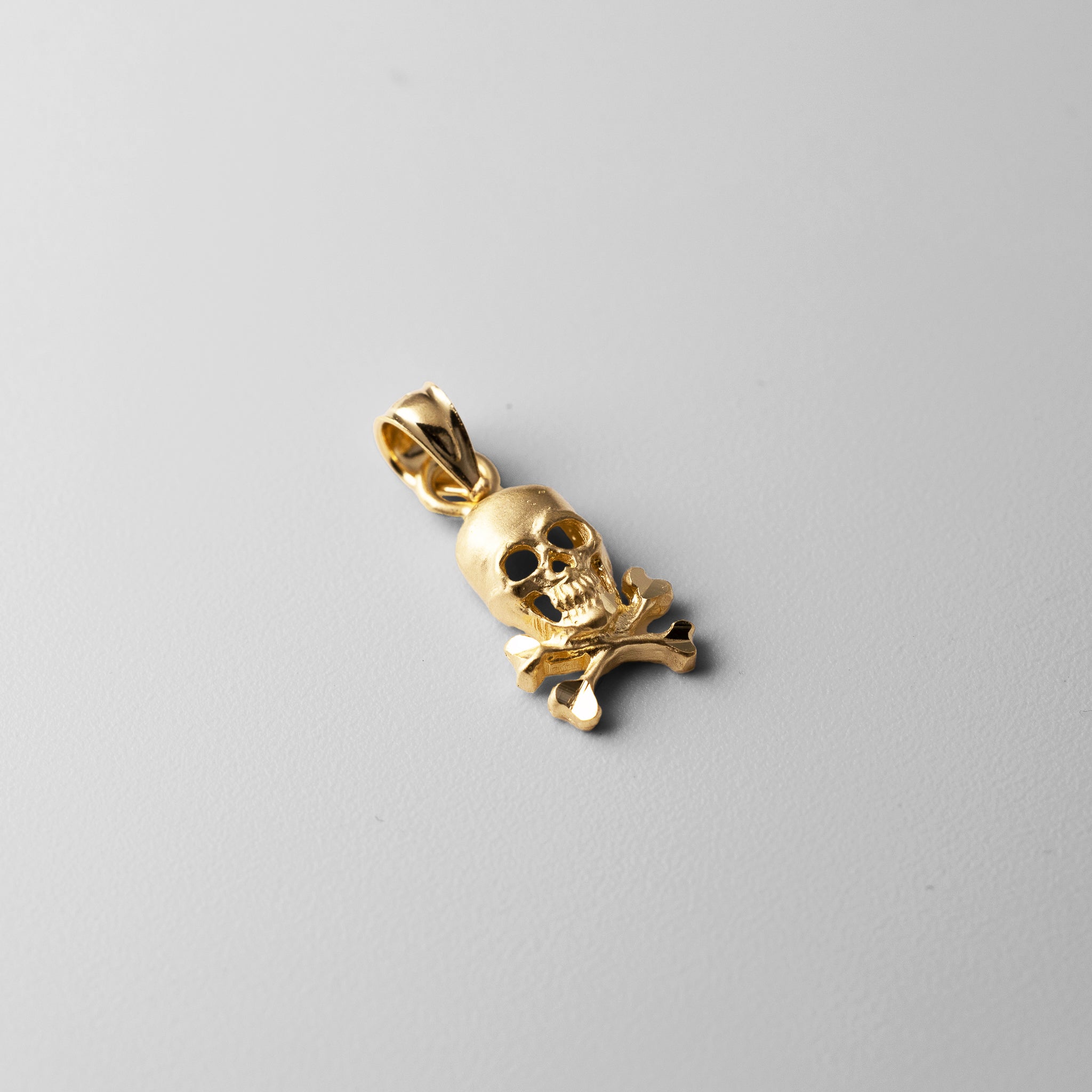 Gold Skull and Crossbones Pendant Model-K3163 - Charlie & Co. Jewelry