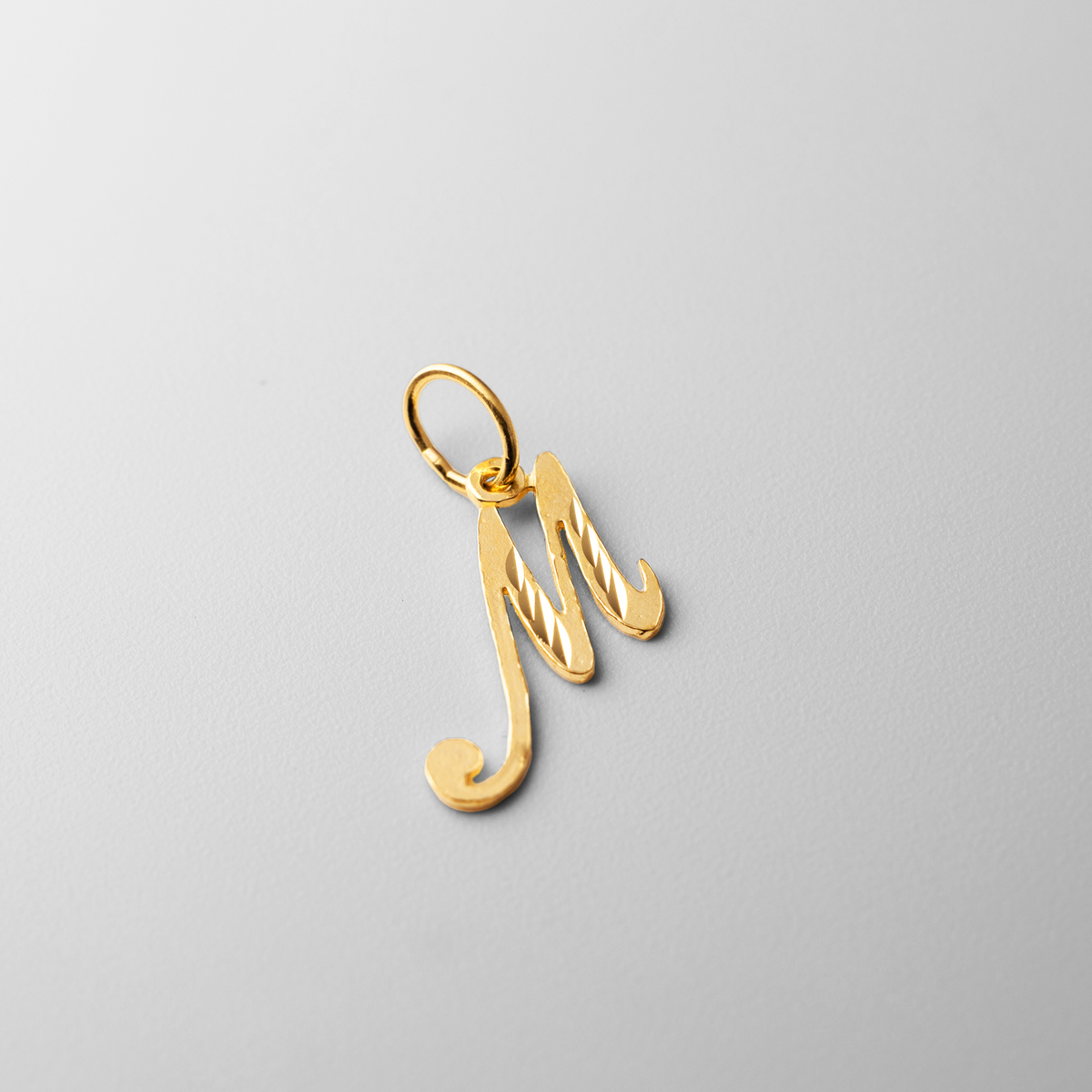 Gold Cursive Letter M Pendant | A-Z Pendants | Charlie & Co
