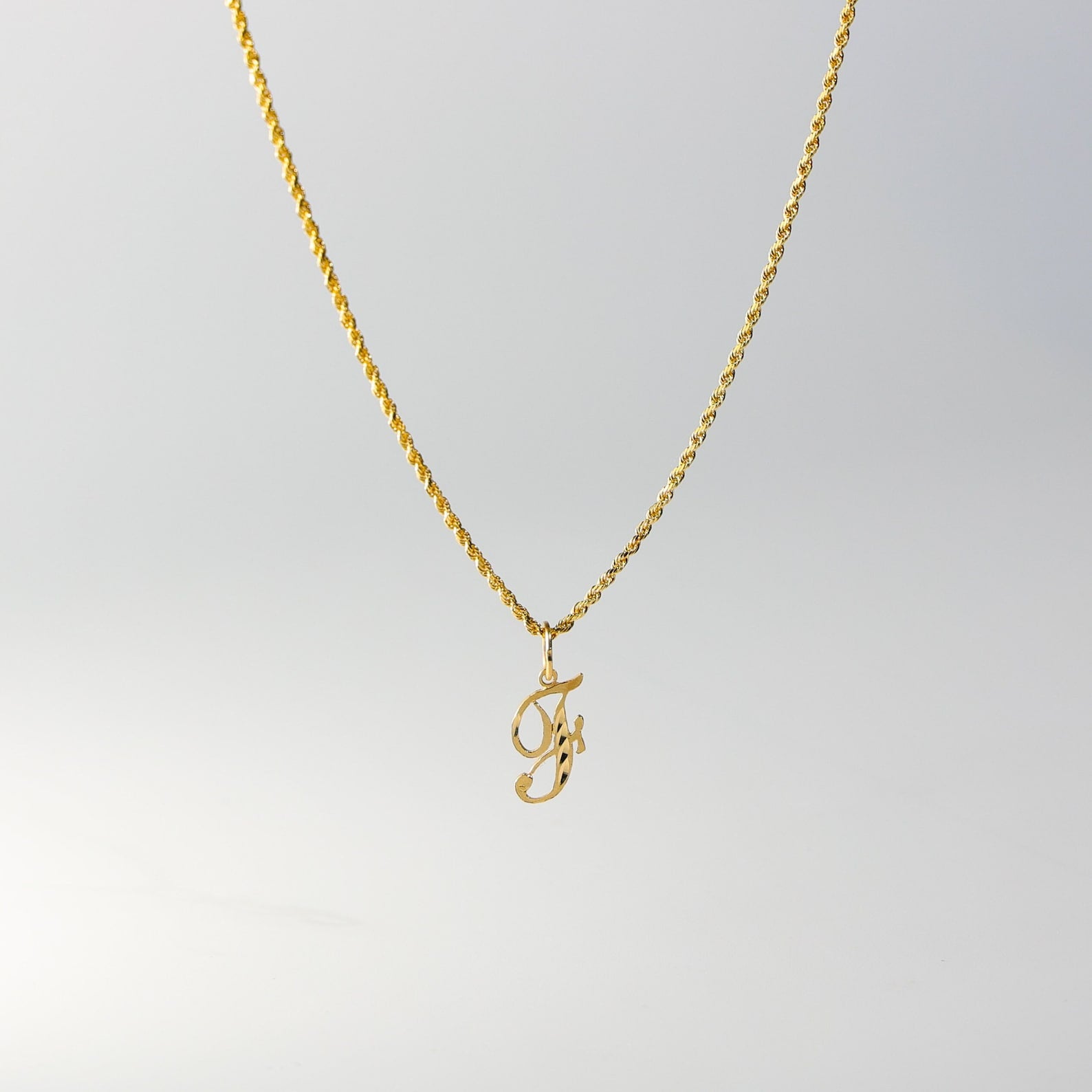 Gold Calligraphy Letter F Pendant | A-Z Pendants - Charlie & Co. Jewelry