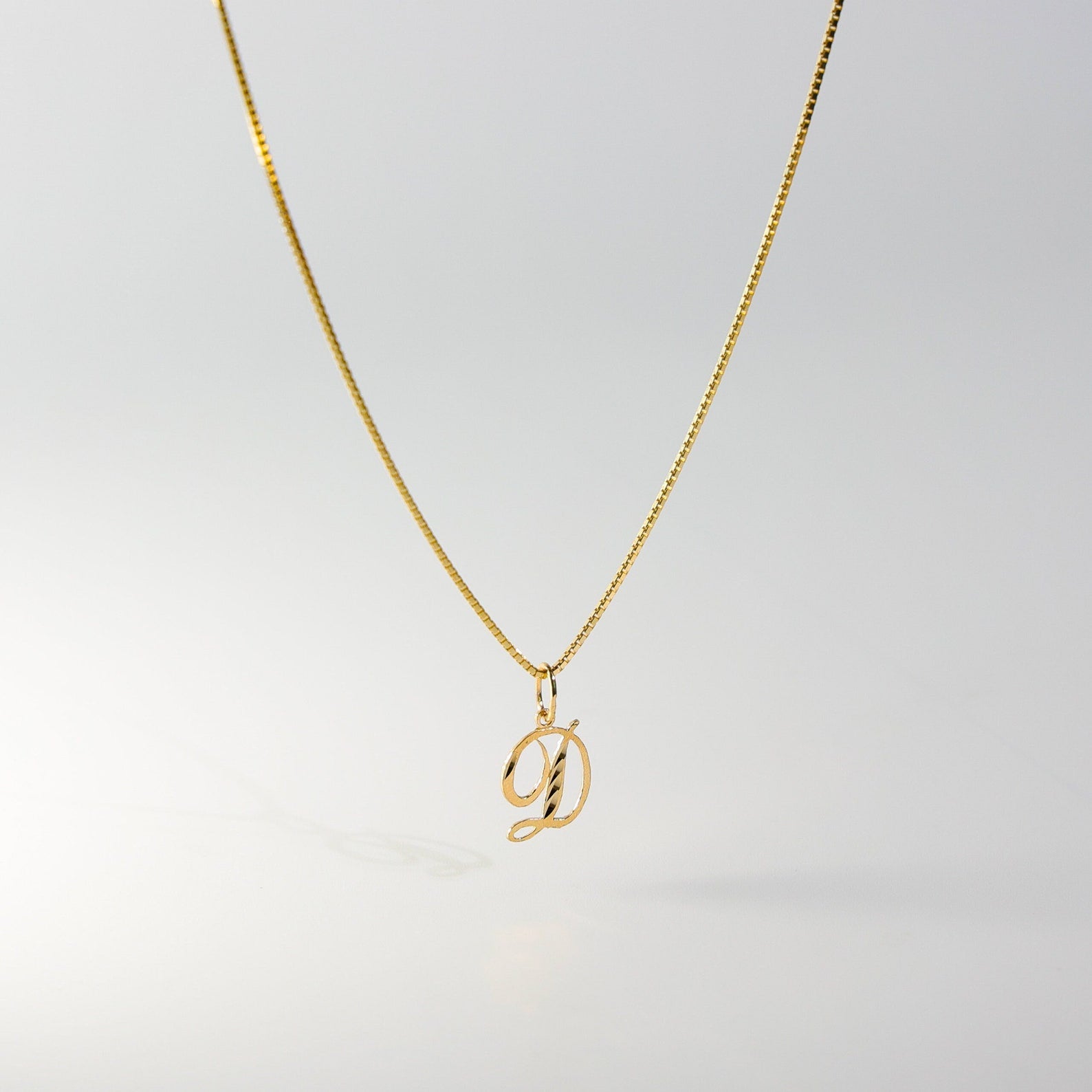 Gold Calligraphy Letter D Pendant | A-Z Pendants - Charlie & Co. Jewelry