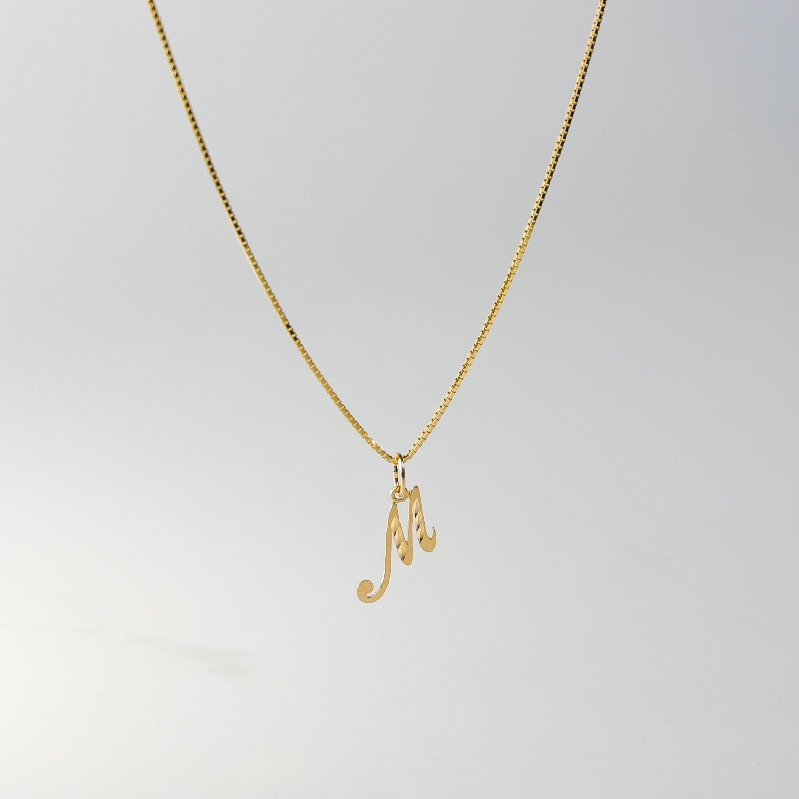 Gold Calligraphy Letter M Pendant | A-Z Pendants - Charlie & Co. Jewelry