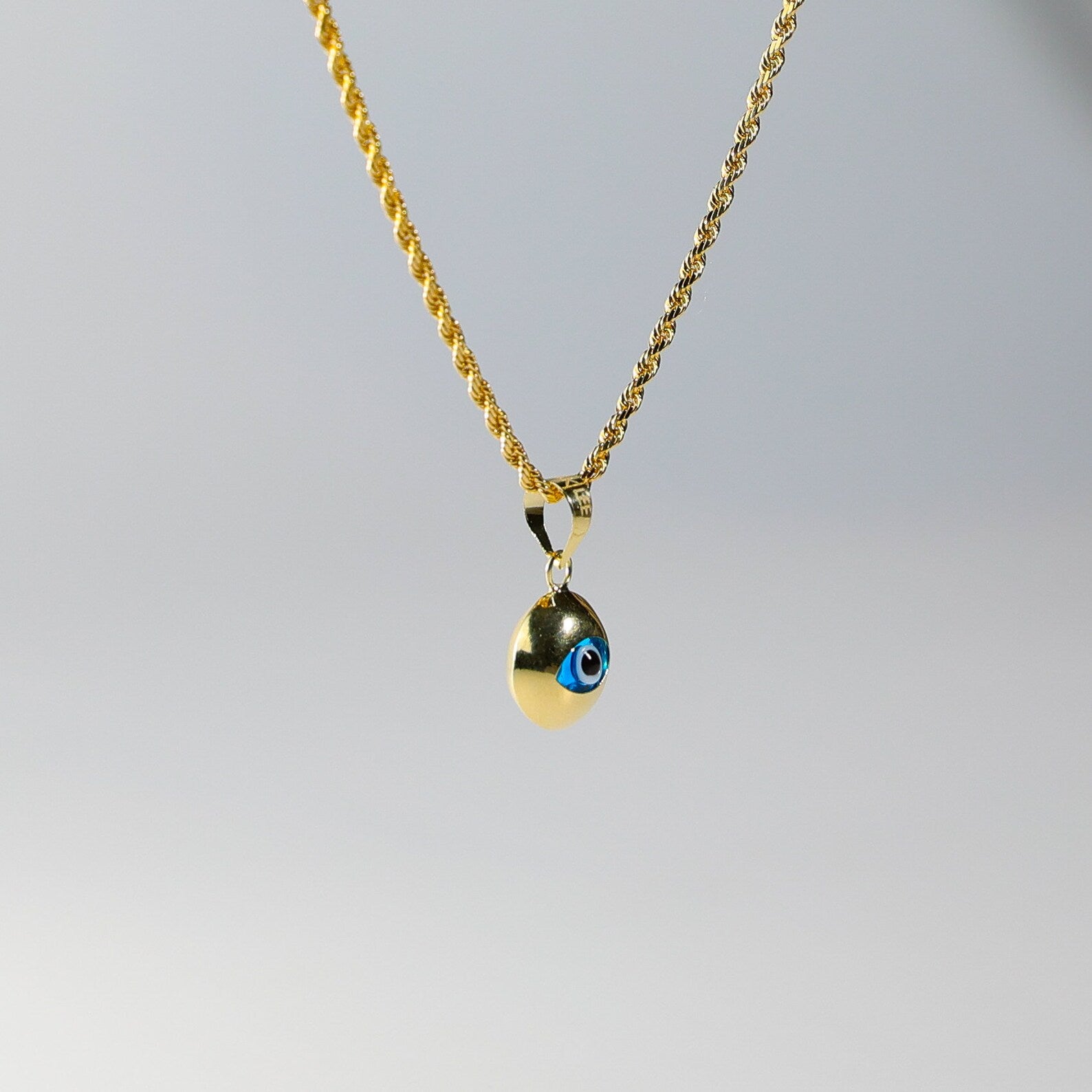 Gold Evil Eye Round Hamsa Pendant - Charlie & Co. Jewelry