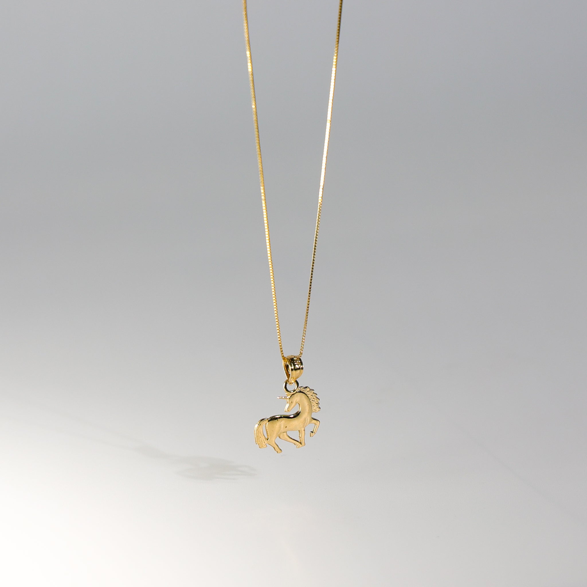 Gold Tiny Unicorn Pendant Model-1651 - Charlie & Co. Jewelry