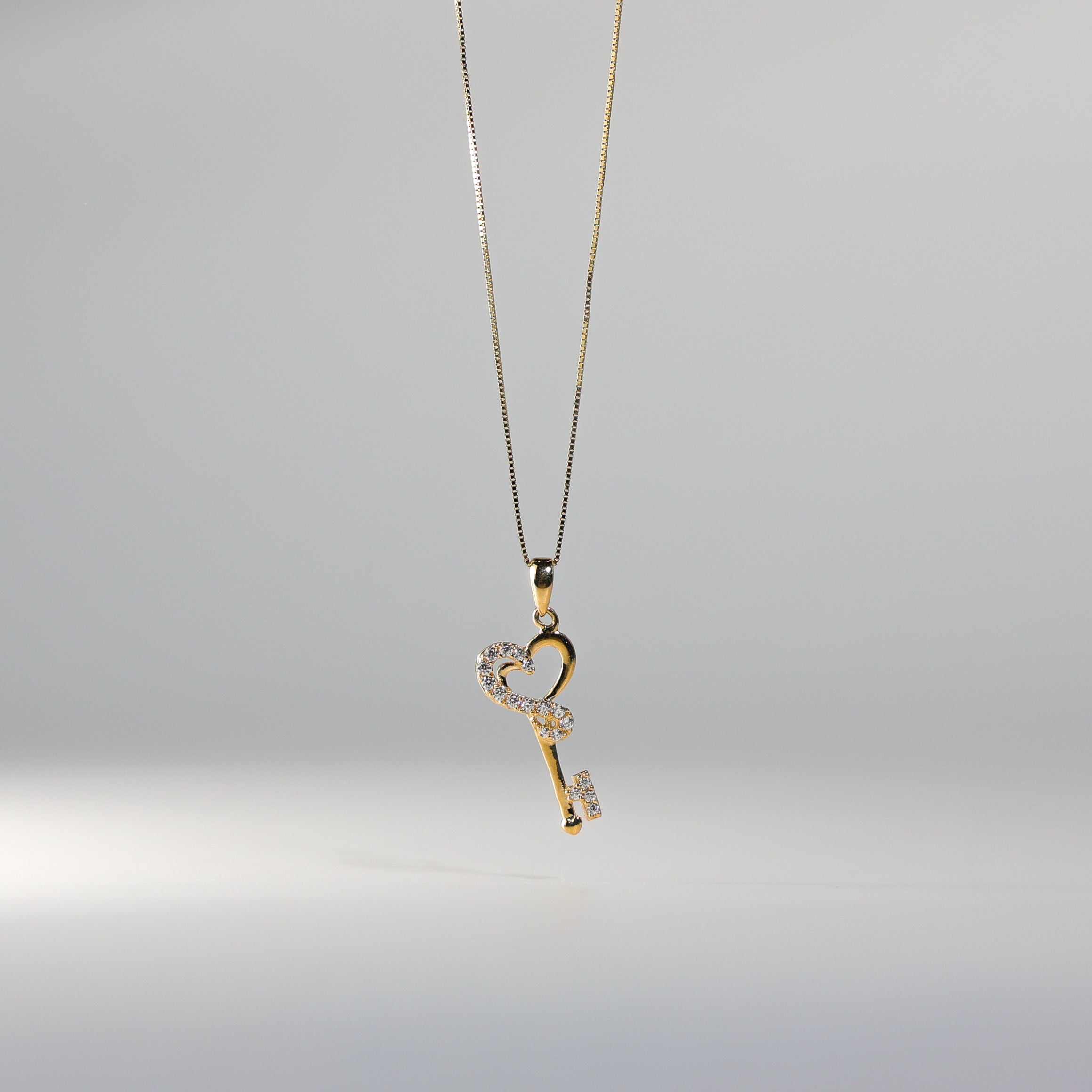 14k Gold Cz Key store Pendent .