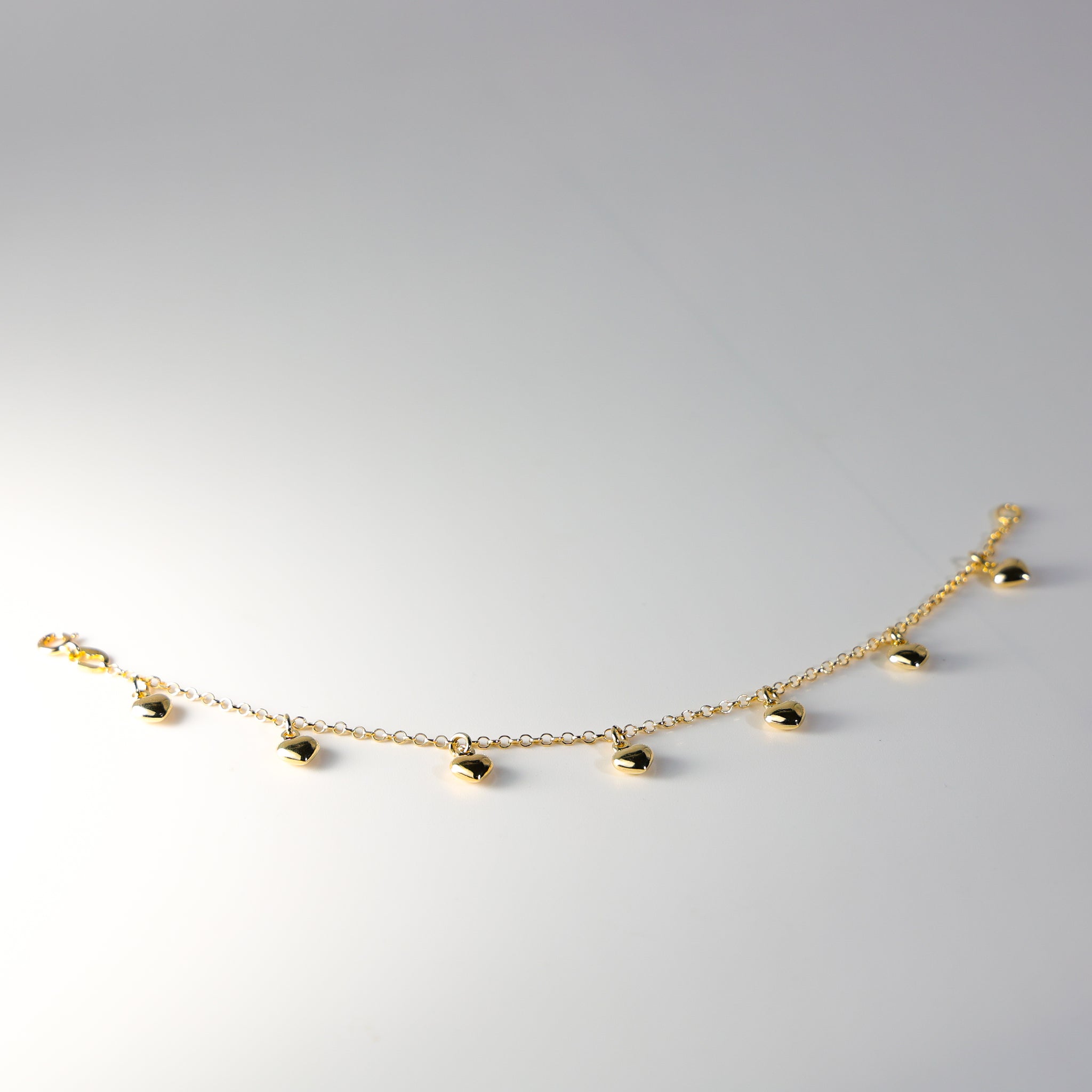 14K Gold Hanging Hearts Bracelet Model-AB0276 - Charlie & Co. Jewelry